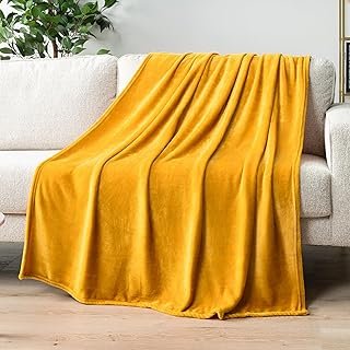 Manta artesanal amarillo mostaza suave y decorativa